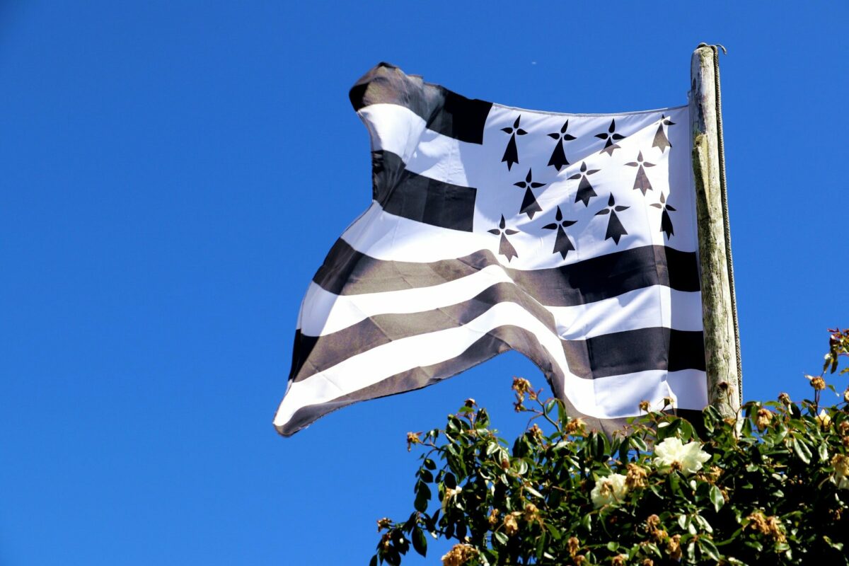 Closeup shot of the flag of Brittany in black and white colors waving in the air